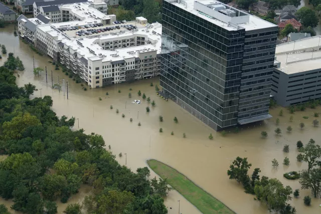 Image of flooded buildings and parking lots