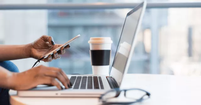 Working on a laptop and cell phone during a disaster