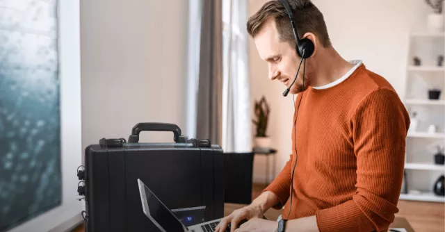 A man works remotely with his ReadyTechGo pack