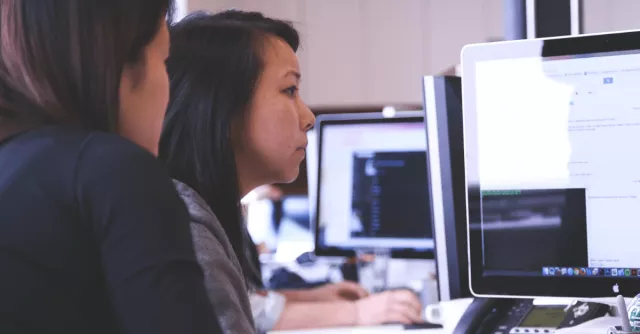 A woman works on a computer