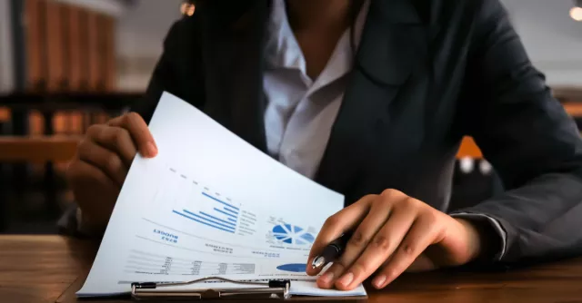 A banker goes through audit materials