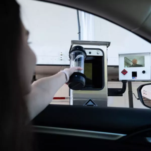Person making a drive-thru deposit