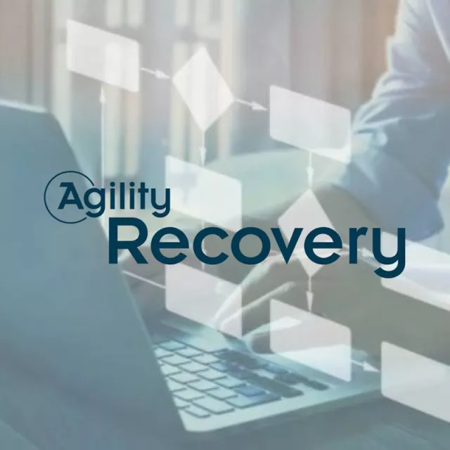 Agility Recovery logo in front of someone using a laptop